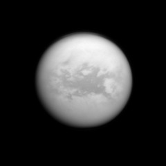 The Cassini spacecraft peers down through the hazy atmosphere of Saturn's moon Titan to view the dark region called Belet. This view looks toward the trailing hemisphere of Titan.