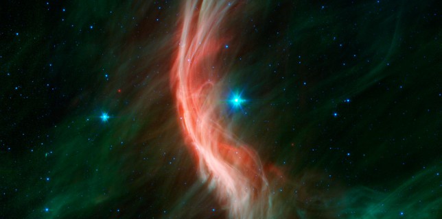 The giant star Zeta Ophiuchi is having a "shocking" effect on the surrounding dust clouds in this infrared image from NASA's Spitzer Space Telescope (NASA)